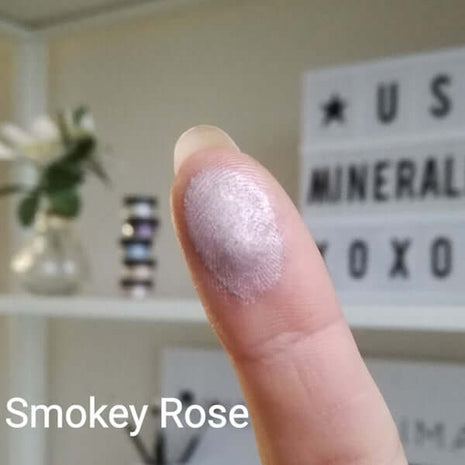 Metallic-Swatch of Smokey Rose on a fingertip